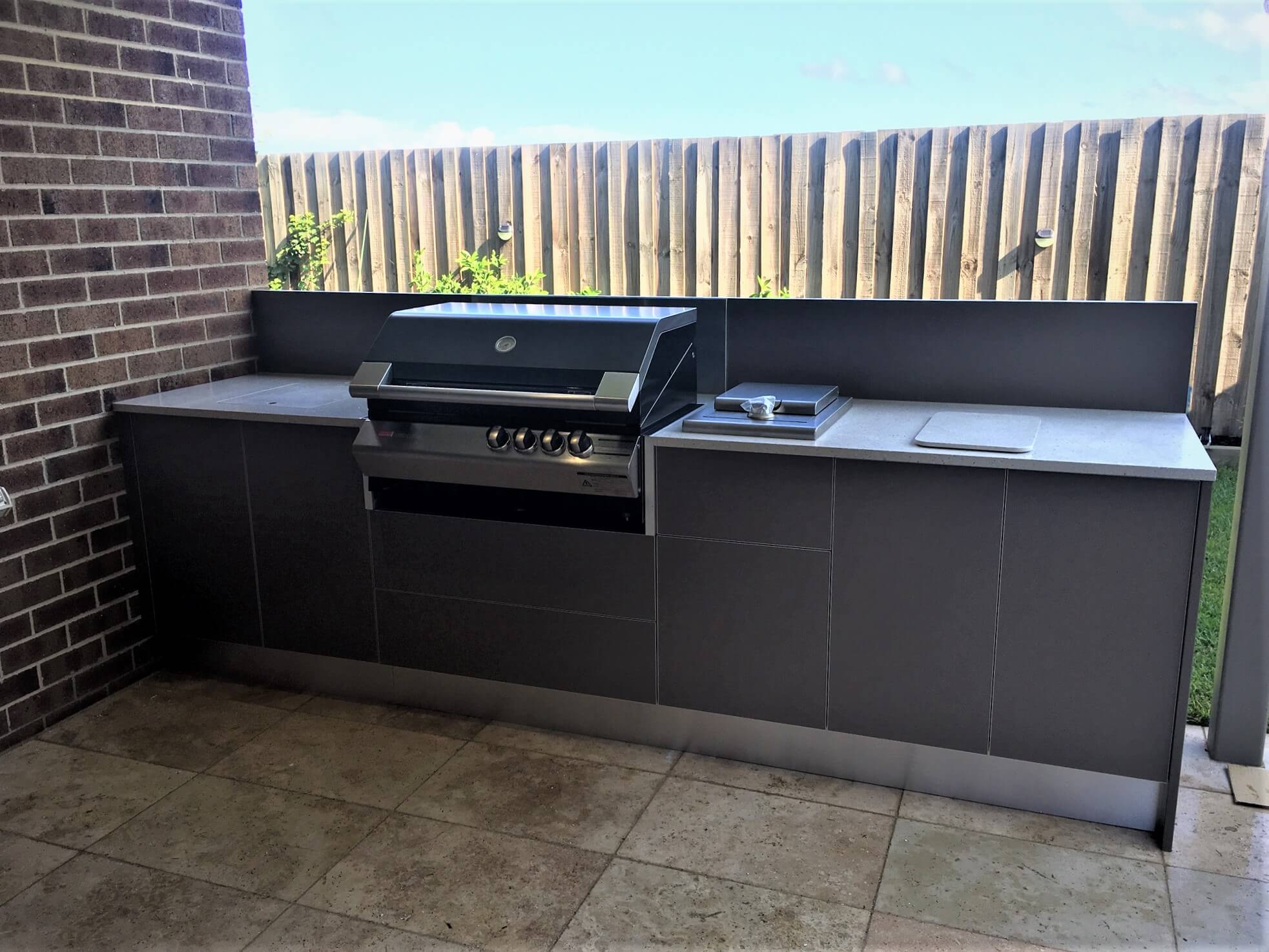 LimeTree Alfresco Zeigler Brown Turbo Classic Matte Mocha Cabinets with Corian Oyster Outdoor Kitchen
